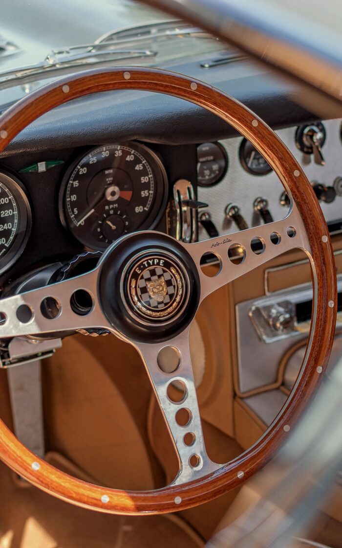 Wood-rimmed steering wheel of a classic motorcar